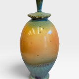 Lidded Vessel with Skulls - orange and green